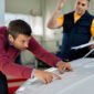 male customer examining car hood while being auto repair shop 85x85